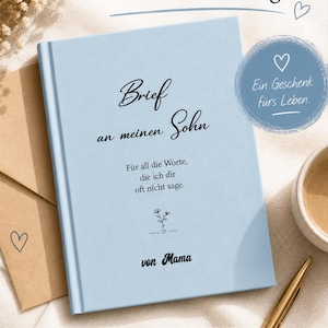 May include: A light blue journal with the text "Brief an meinen Sohn" and "Für all die Worte, die ich dir oft nicht sage." The journal is next to a cup of coffee and a pen. The journal is a gift.