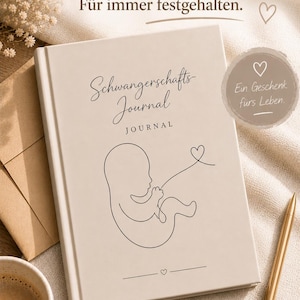 May include: A beige pregnancy journal with the words "Schwangerschafts-Journal" and a line drawing of a fetus. The journal has a gold pen and a cup of coffee next to it. The text "Eure Schwangerschafts-Reise. F&uuml;r immer festgehalten" is at the top.