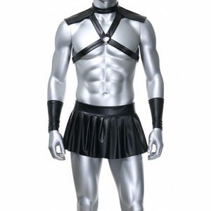 May include: Black faux leather outfit featuring a harness top with a ring detail, a choker, and a pleated mini-skirt. The outfit includes matching wrist cuffs. The mannequin is silver and the background is white.