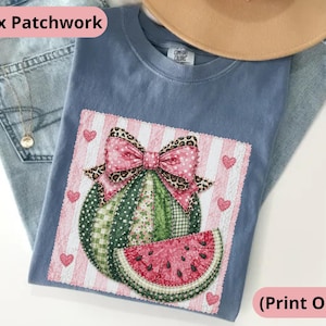May include: A blue t-shirt featuring a watermelon design with a pink bow and a slice of watermelon. The design is set against a pink and white striped background with heart accents. The words "Faux Patchwork" and "(Print Only)" are visible.
