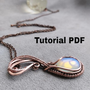 May include: A handmade copper wire pendant featuring an opal stone in a teardrop shape. It hangs from a copper chain. The text "Tutorial PDF" is displayed in black letters.