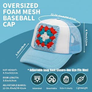 May include: Light blue oversized foam mesh baseball cap with a white front panel and a crocheted square design in red, blue, and white. The hat has a mesh back, a brim length of 3.5 inches, and an adjustable range of 22-24.4 inches.