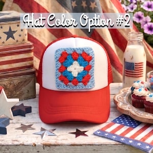 May include: Red and white trucker hat with a crocheted square patch in the center. The patch features a blue, red, and white design. The text "Hat Color Option #2" is above the hat.