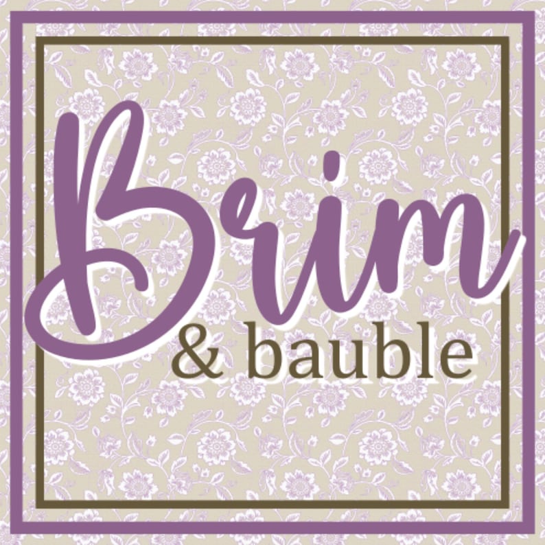 May include: Square graphic with the words "Brim & bauble" in a purple script font. The background is a floral pattern in light purple and beige. The text is framed by a purple border and a brown border.