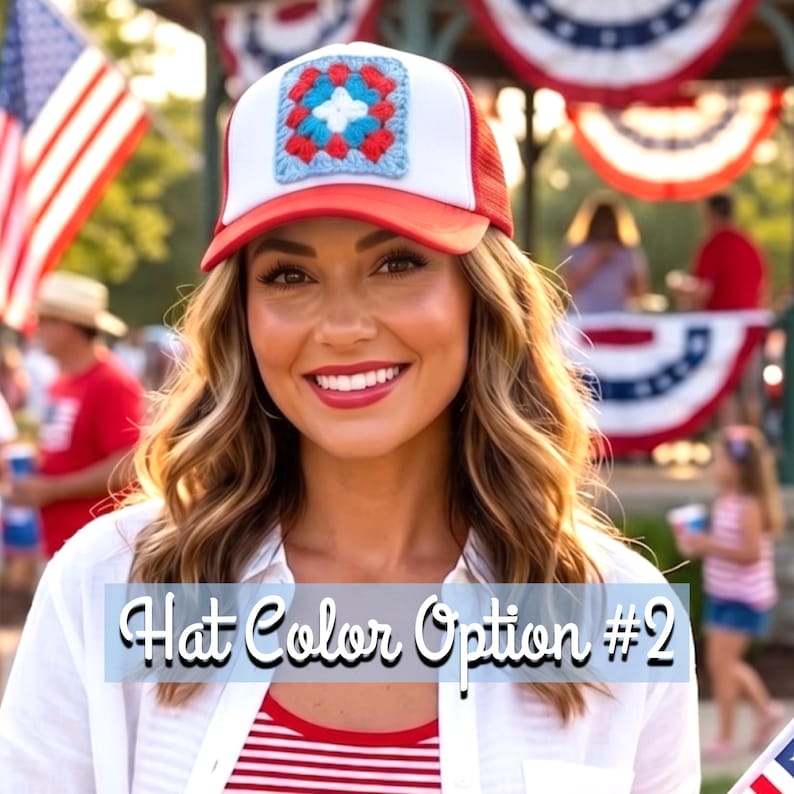 May include: A red and white trucker hat with a square, crocheted patch in the center. The patch features a blue, red, and white design. The hat has a red brim and a white mesh back. Text on the image reads "Hat Color Option #2".