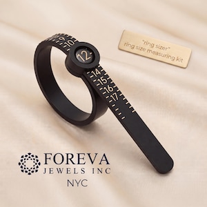 May include: A black plastic ring sizer tool with gold-colored markings and the number 12 displayed in a circular window. A rectangular gold-colored tag reads "ring sizer" ring size measuring kit. The logo FOREVA JEWELS INC NYC is visible.