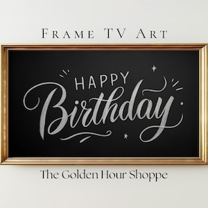 May include: A framed digital art piece with a black background and gold frame. The words "Happy Birthday" are written in elegant white script. The text "FRAME TV ART" and "The Golden Hour Shoppe" are also visible.