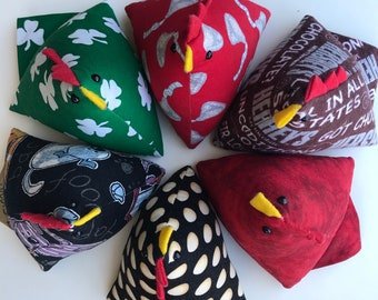 Chicken Pincushion in various solid colors and prints.