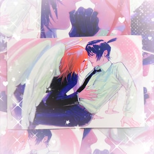 May include: A print featuring anime-style artwork of two figures in an embrace. One figure has red hair, angel wings, and a halo. The other figure has black hair and a tie. The background is a soft pink with white stars.