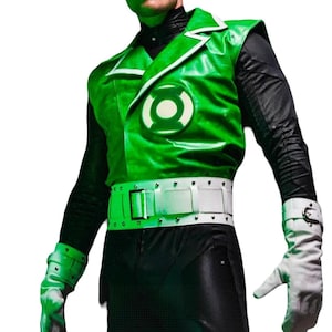 May include: Green Lantern costume featuring a green and white vest with a circular emblem, a white belt, black pants, and white gloves. The costume has a superhero theme.