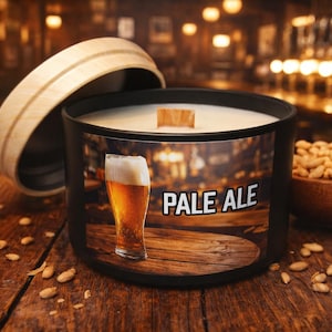 May include: A white ceramic mug with a black handle and the text "But First, Coffee" in a black, bold font. The mug is sitting on a wooden surface. The mug is approximately 4 inches tall.