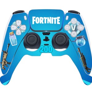 May include: A blue and white Fortnite-themed video game controller. The controller features the word "FORTNITE" in white, along with game-related graphics and the number "200".