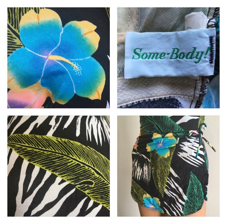 Pode incluir: Saia envelope preta com estampa floral tropical, flores de hibisco azuis e amarelas, folhas verdes e padr&atilde;o de zebra. Fechamento com la&ccedil;o. A etiqueta diz "Some-Body!"