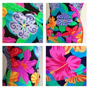 Peut inclure: Un maillot de bain une pi&egrave;ce avec un motif floral vibrant. Le design pr&eacute;sente de grandes fleurs dans des tons de rose, violet, jaune et orange sur un fond noir. Des feuilles vertes et des accents bleus compl&egrave;tent le look tropical.