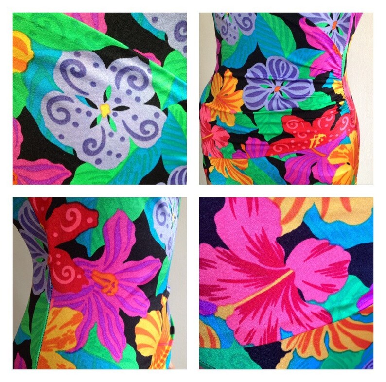 Peut inclure: Un maillot de bain une pi&egrave;ce avec un motif floral vibrant. Le design pr&eacute;sente de grandes fleurs dans des tons de rose, violet, jaune et orange sur un fond noir. Des feuilles vertes et des accents bleus compl&egrave;tent le look tropical.
