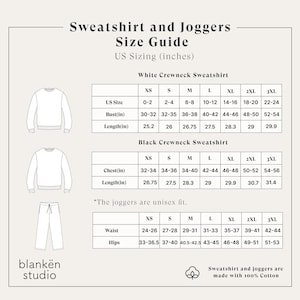 May include: A size guide for sweatshirts and joggers, with US sizing in inches. The guide includes measurements for white and black crewneck sweatshirts, and unisex joggers. The text states the garments are made with 100% cotton.