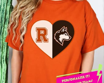 May include: An orange short-sleeved t-shirt featuring a large heart graphic on the chest. The heart is split into two halves: the left side is cream with a large orange letter R, and the right side is dark brown with a white husky dog head icon.