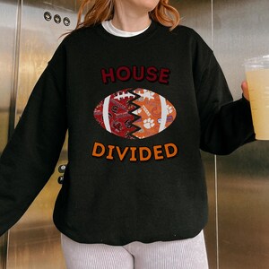 a woman holding a glass of beer in front of a refrigerator