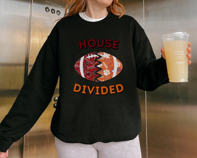 a woman holding a glass of beer in front of a refrigerator