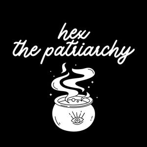 May include: A black and white graphic featuring the text "hex the patriarchy" in a cursive font. Below the text is a white cauldron with steam rising, and an eye symbol. The image has a witchy, mystical theme.