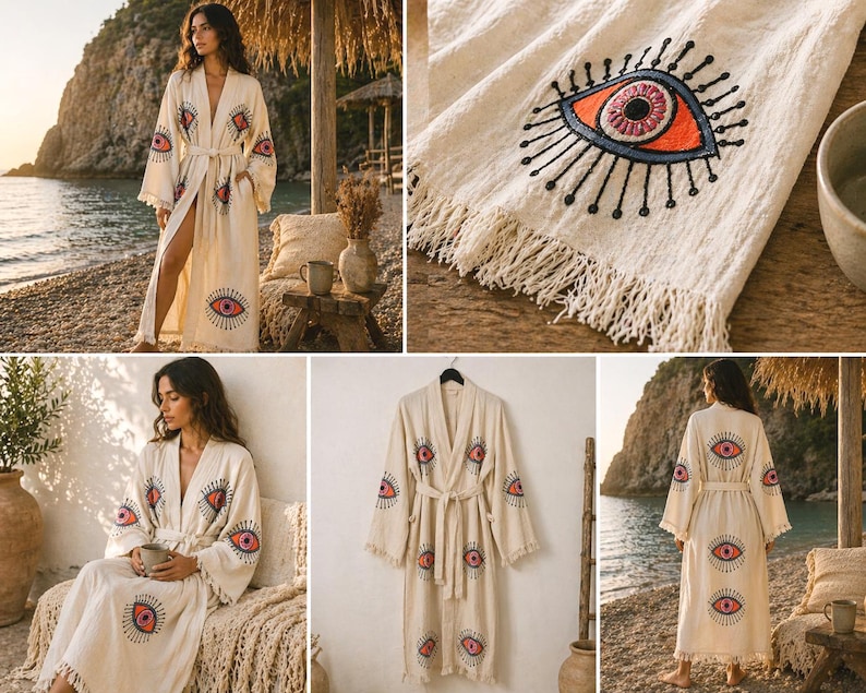 May include: Cream-colored robe with an embroidered eye design in red, orange, and black. The robe has long sleeves, a belt, and fringe detailing. The eye motif is repeated on the sleeves and front of the robe. The robe is made of a soft, flowing fabric.