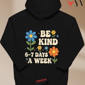 May include: Black hoodie with a floral design and the words "BE KIND 6-7 DAYS A WEEK" in white. The flowers are blue, yellow, and orange. The hoodie has a drawstring hood and a kangaroo pocket.