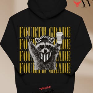 May include: A black hooded sweatshirt featuring a graphic of a raccoon wearing a checkered cap, heart-shaped sunglasses, and a striped bandana. The raccoon holds a pencil and a coffee cup. The text FOURTH GRADE is repeated in gold behind it.