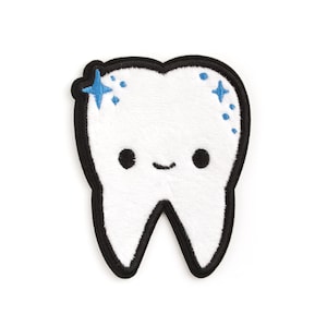 May include: A white plush tooth with a black outline and a happy face. The tooth has two blue stars on it.