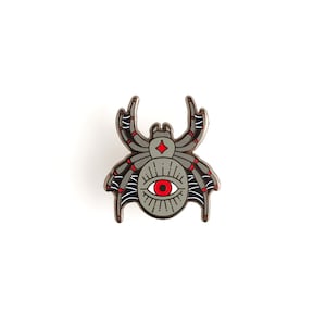 May include: A gray spider with a red eye and a diamond on its head. The spider is outlined in black and has red accents on its legs.