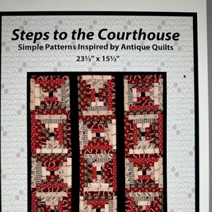 May include: A quilt pattern titled "Steps to the Courthouse" with a red, white, and black color scheme. The pattern is inspired by antique quilts and measures 23 1/2 inches by 15 1/2 inches.