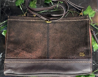 Bolso bandolera retro Sak de tela y cuero marrón metalizado.