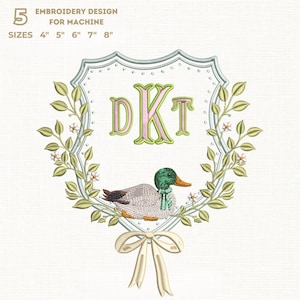 May include: An embroidery design featuring a duck within a shield-shaped frame, surrounded by a floral wreath and a bow. The design includes the letters "DKT" and the text "EMBROIDERY DESIGN FOR MACHINE" and sizes 4", 5", 6", 7", and 8".