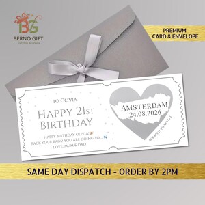 May include: A gray envelope with a white ribbon and a birthday card. The card reads "Happy 21st Birthday" and includes the text "Amsterdam 24.08.2026". The card is designed to be scratched to reveal a message.