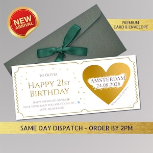 May include: A birthday card with a gold heart and the text "Happy 21st Birthday" and "Amsterdam 24.08.2026". The card is inside a gray envelope tied with a green ribbon. A "New Arrival" sticker is in the upper left corner.