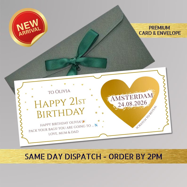 May include: A birthday card with a gold heart and the text "Happy 21st Birthday" and "Amsterdam 24.08.2026". The card is inside a gray envelope tied with a green ribbon. A "New Arrival" sticker is in the upper left corner.