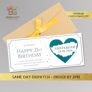 May include: A birthday card with a teal heart-shaped design featuring the word "Amsterdam" and the date "24.08.2026". The card is addressed to Olivia and says "Happy 21st Birthday". It comes with a cream-colored envelope and a yellow ribbon.