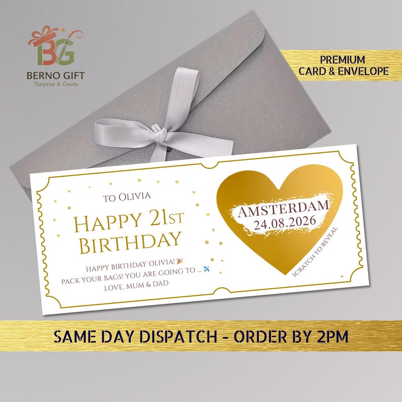 May include: A white birthday card with gold accents and a gold heart-shaped scratch-off area. The card reads "Happy 21st Birthday Olivia" and includes the text "Amsterdam 24.08.2026". It is paired with a gray envelope and a white ribbon.