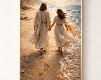 May include: A framed print depicts two figures walking hand-in-hand on a sandy beach, with the ocean in the background. They are wearing flowing, light-colored robes. Footprints are visible in the sand. The artwork has a warm, golden color palette.
