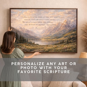 May include: A framed landscape art print featuring a mountain scene with a lake and forest. The artwork includes the scripture from Psalm 121:1-2. The text "PERSONALIZE ANY ART OR PHOTO WITH YOUR FAVORITE SCRIPTURE" is also displayed.