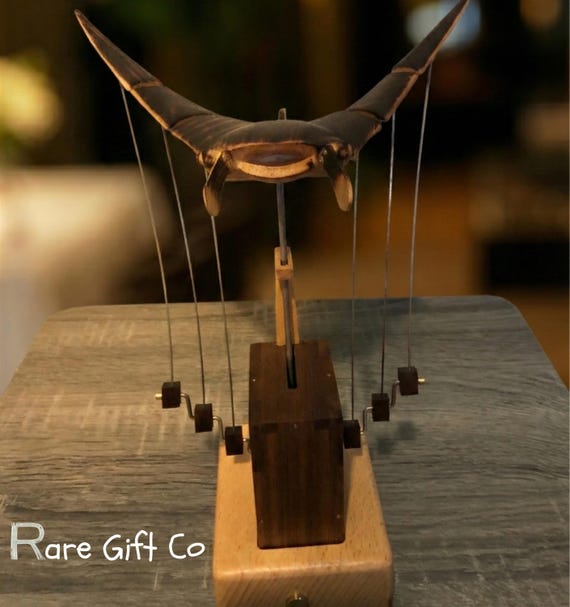 A motorized flying manta ray that actually flaps its wings — 570 hearts confirm this is the ocean-desk-decor piece people didn't know they needed.
