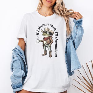 funny frog cowboy st patricks day png, retro shenanigan frog shirt design, vintage western irish green frog, frog riding cowboy funny illustration, st paddys day green frog art, distressed green cowboy frog sublimation, whimsical irish shenanigan digital download, lucky frog cowboy hat western png, funny st patricks day humor for adults, vintage woodcut style frog cowboy design