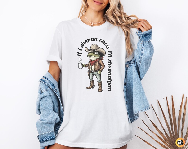 funny frog cowboy st patricks day png, retro shenanigan frog shirt design, vintage western irish green frog, frog riding cowboy funny illustration, st paddys day green frog art, distressed green cowboy frog sublimation, whimsical irish shenanigan digital download, lucky frog cowboy hat western png, funny st patricks day humor for adults, vintage woodcut style frog cowboy design