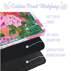 May include: A layered product with a floral design, featuring pink peonies and green accents. The top layer is fabric, followed by XPE shock absorption, and a non-slip rubber backing. The text "Golden Pond Mahjong" is at the top.