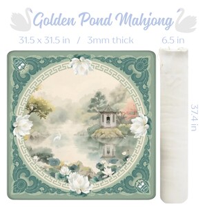 May include: A square mahjong mat with a serene pond scene, featuring a pagoda and white flowers, framed by a teal border. The mat measures 31.5 x 31.5 inches and is 3mm thick. A matching white, rolled-up mat is also shown, measuring 6.5 inches in diameter and 37.4 inches long. The text "Golden Pond Mahjong" is at the top.