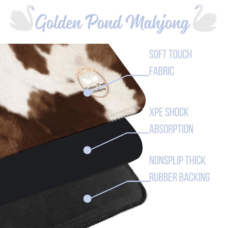 May include: A layered product with a cowhide pattern top, black middle layer, and a textured black bottom. The text "Golden Pond Mahjong" is at the top, with labels for "Soft Touch Fabric", "XPE Shock Absorption", and "Nonslip Thick Rubber Backing".