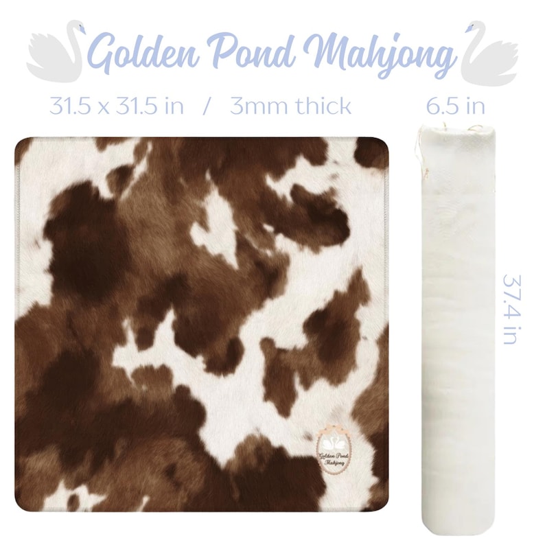 May include: A square mahjong mat with a brown and white cowhide pattern, measuring 31.5 x 31.5 inches and 3mm thick. A white, rolled mat, 6.5 inches in diameter and 37.4 inches long, is next to it. The text "Golden Pond Mahjong" is at the top.