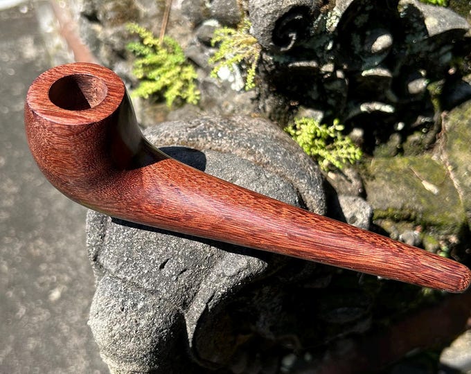 Tobacco pipe. Simple regular Smoking pipe from single wooden block carving durable dark solid wood.