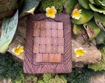 Handcrafted Divination Runes made from selected Iron wood, featuring gold-painted symbols in traditional Balinese style. Elder Futhark runes