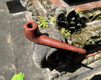 Tobacco pipe. Simple regular Smoking pipe from single wooden block high quality carving durable dark solid wood.