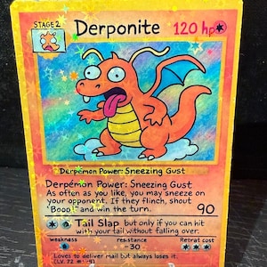 May include: A holographic trading card with a cartoon dragon-like creature named "Derponite" and "120 hp." The card has a yellow border and includes game instructions and the text "Loves to deliver mail but always loses it."